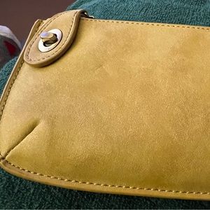 Brand new small clutch purse or wristlet style. Beautiful light green color.